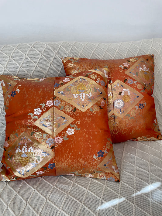 Cushion cover upcycled from obi sash with embroideries in deep orange