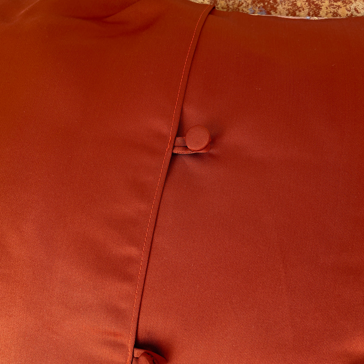 Cushion cover upcycled from obi sash with embroideries in deep orange